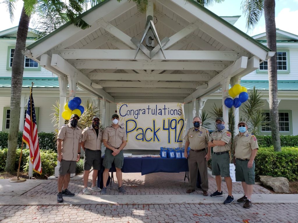 West Broward Lodge No.253 has been sponsoring a Cub Scout Pack and Boy Scout Troop for 25 years; it was originally started by a West Broward Lodge Brother.
Today, June 13th, 2020 the Cub Scout Pack 492 had a drive-by Crossover; a ceremony that advances them to the next rank level.
Thirty-nine kids came to gather their awards they earned for the year, new rank neckerchief and handbook, with some candy and toys.  
